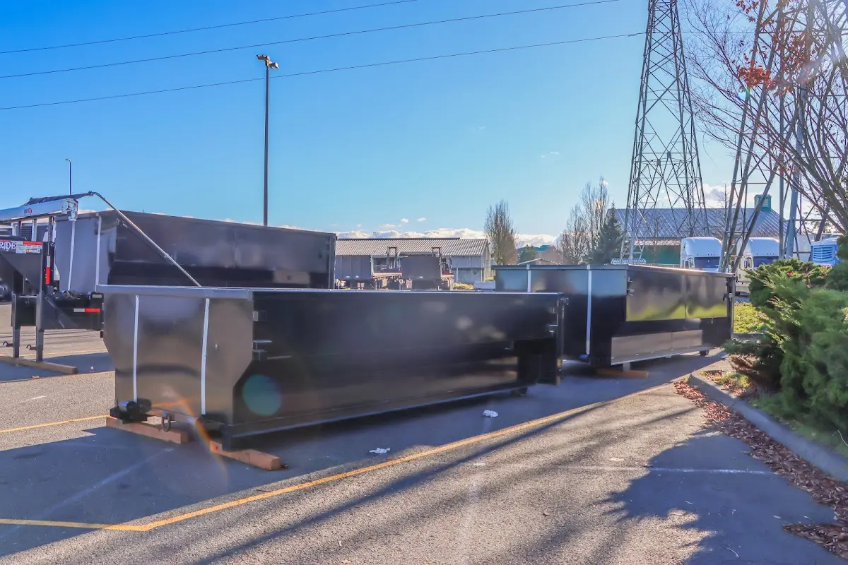 Roll-off dumpster ready for waste disposal at job site for Demolition Dumpster Rental in Palm Valley